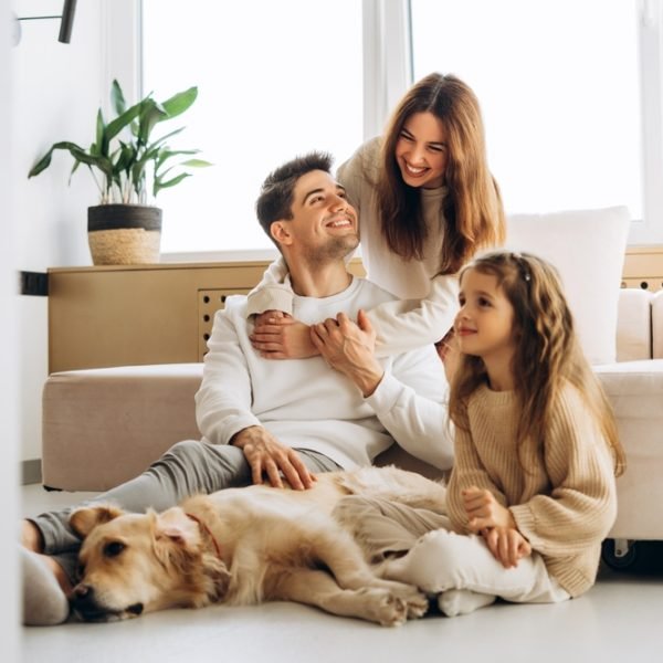 Smiling,Family,Spending,Quality,Time,Together,With,Their,Golden,Retriever Smiling,Family,Spending,Quality,Time,Together,With,Their,Golden,Retriever